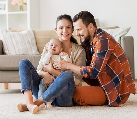 family-parenthood-people-concept-happy-mother-father-baby-home (1)