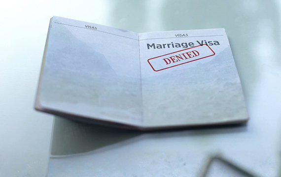 Can a green card be denied for a spouse?